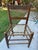 Matching set of 9 antique American slat-back chairs with original painted decoration and woven rawhide seats. Green...