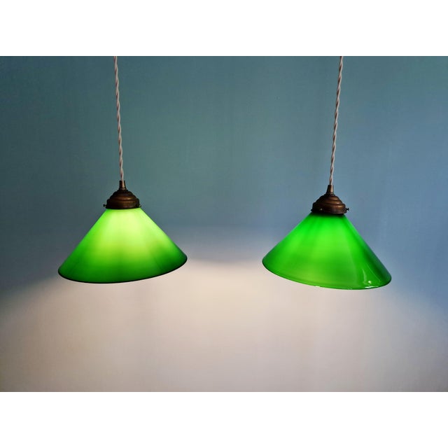 Pair of Art Deco style conical green opaline glass pendant lights. Each light has been rewired with a beige twisted cable...