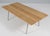 Hans J. Wegner coffee table, made in solid oak. Legs of brushed steel. Model CH413, made by Carl Hansen & Son. This piece...