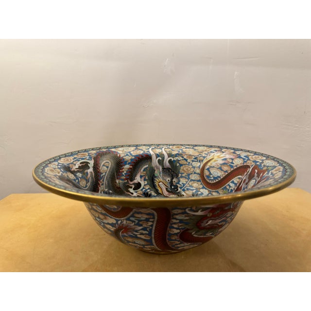 A very impressive cloisonné bowl with Red and black imperial 5 clawed dragons. They are powerful symbols representing the...