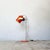 A Combi Lux table lamp designed by Stanislav Indra for Lidokov, Czechoslovakia, 1970s. Orange lacquered metal shade and...