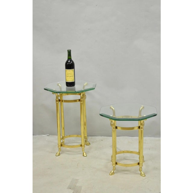Vintage Hollywood Regency Brass Hoof Foot Glass Top Graduating Side Tables - Pair. Tables feature thick octagonal glass...
