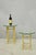 Vintage Hollywood Regency Brass Hoof Foot Glass Top Graduating Side Tables - Pair. Tables feature thick octagonal glass...
