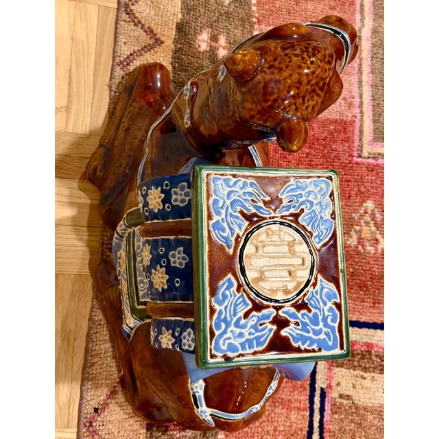 Gorgeous vintage Chinoiserie ceramic camel. Harder to come by than the more common elephant. Can be used as a stool, table...