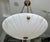 An elegant and timeless French pendant light designed in the classical Directoire style, featuring a carved white...