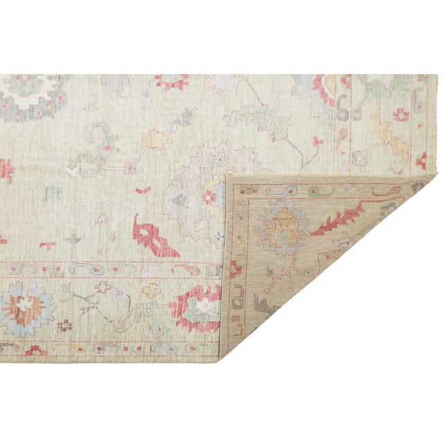 Enhance your space with this beautiful, hand-knotted Modern Oushak-style rug. Made from high-quality wool, it has an open...