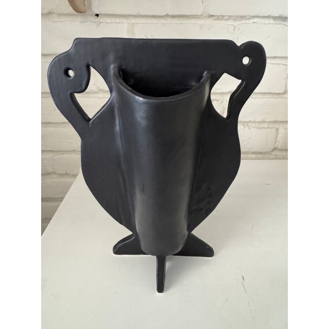 Deliberately off kilter urn vase with brocade textured matte black finish. Quirky fun, with or without flowers.