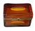 A striking mid century amber art glass casket box featuring richly colored translucent amber glass with distinctive oval...