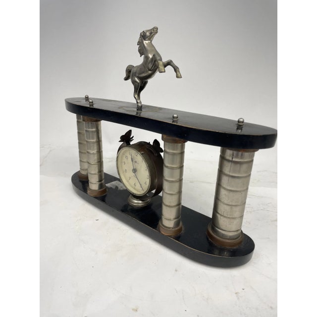 Beautiful ornamental clock with colonnade and horse, Art Deco style, 1920s.