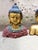 A set of 3 beautiful Iron Buddha busts, painted in a chic gold with royal blue, green and red detailing. The center Buddha...