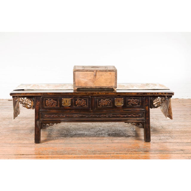 An Indian rustic wooden box from the 19th century, with nicely weathered appearance, iron details and incised motifs....