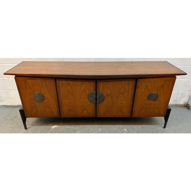 This Helen Hobey Baker vintage mid-century modern credenza features distinctive sculptural walnut wood grain and unique...