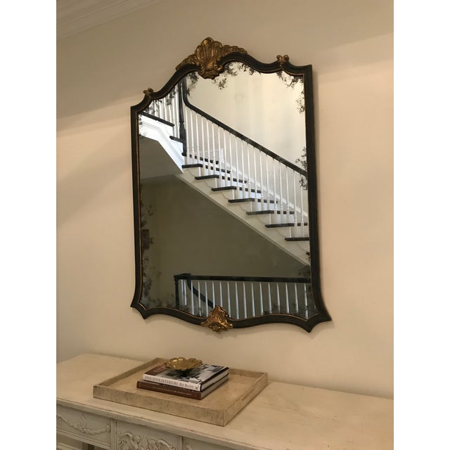 Black distressed finish with Borghese Gold Accents. Mirror antiqued lightly around the perimeter. Dimensions 47” W x 62” H.