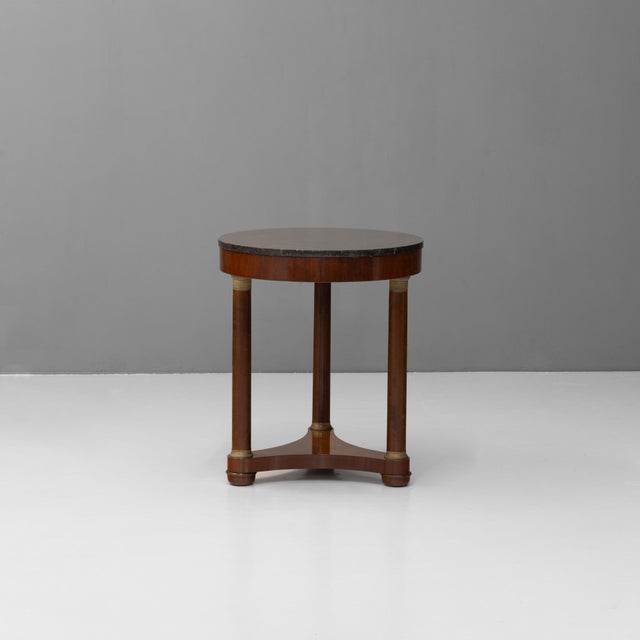French mahogany Empire style marble top gueridon. Circa 1920.