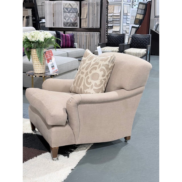 This is a beautifully tailored George Smith signature armchair showcasing the brand’s classic English rolled arm profile...