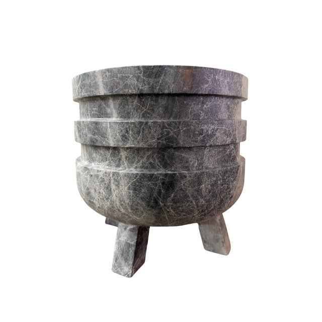 Handcrafted from richly veined dark gray marble, the Courbe Planter is defined by its rounded silhouette, layered...