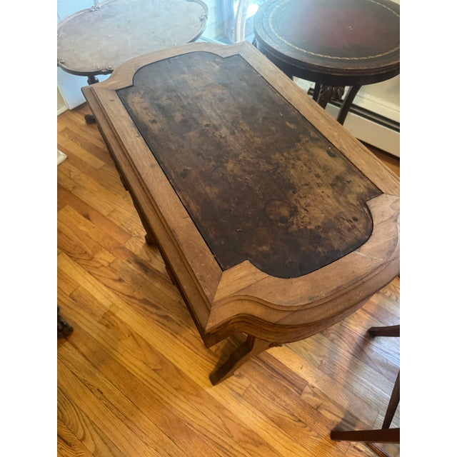 American Victorian Eastlake-style walnut sewing table or writing desk. The table has a barrel shaped drawer underneath for...