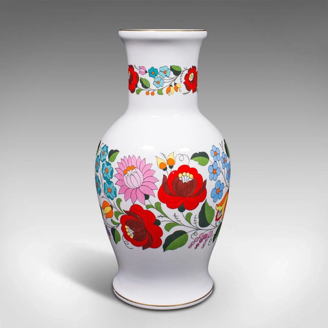 This is a large vintage flower vase. An Hungarian, ceramic baluster vase with colourful decoration, dating to the late...