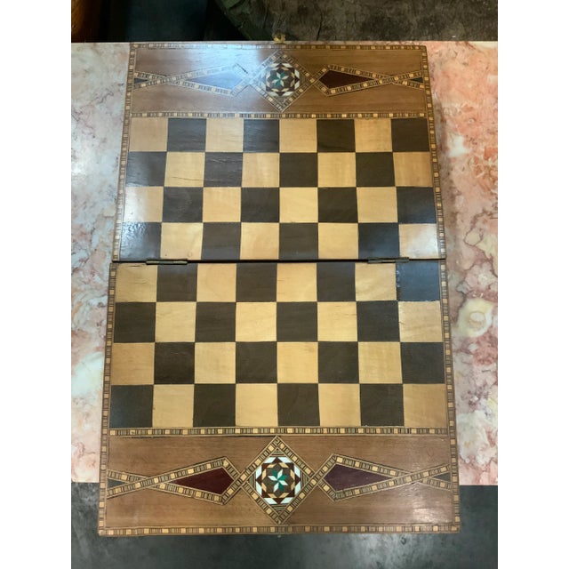 A beautifully decorated Moroccan chessboard from the mid 20th century. This high quality crafted construction of a chess...