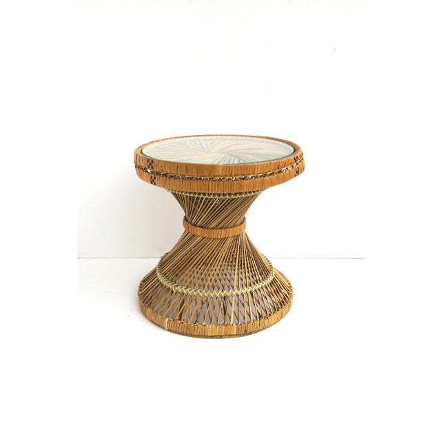 A round wicker and glass drinks side table with hourglass shape, Bohemian design, circa mid-20th century. Table is a...