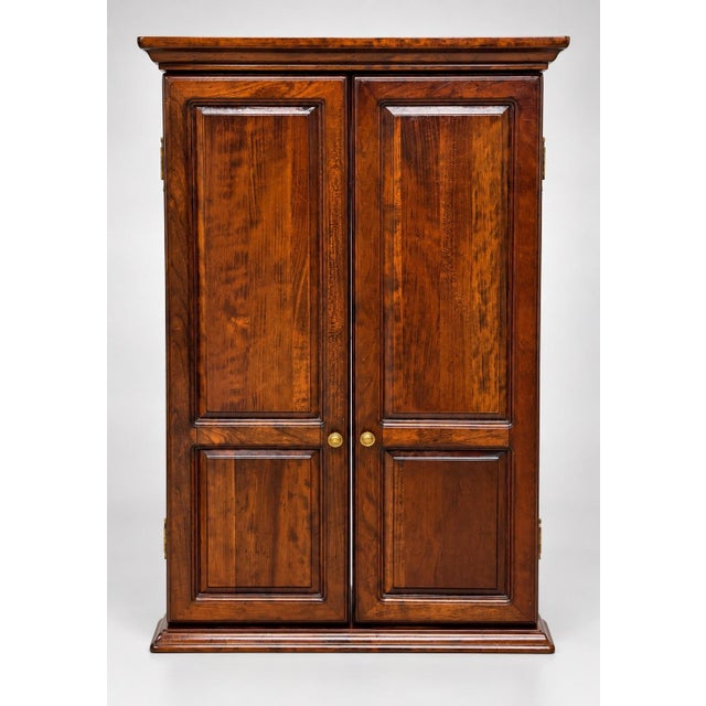 A rectangular wooden trifold mirror featuring a large central plate glass mirror flanked by two hinged side panels with...