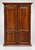 A rectangular wooden trifold mirror featuring a large central plate glass mirror flanked by two hinged side panels with...