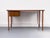 Compact desk with a solid teak top, beneath which is a cabinet with two drawers, the upper one lockable. A clean, timeless...