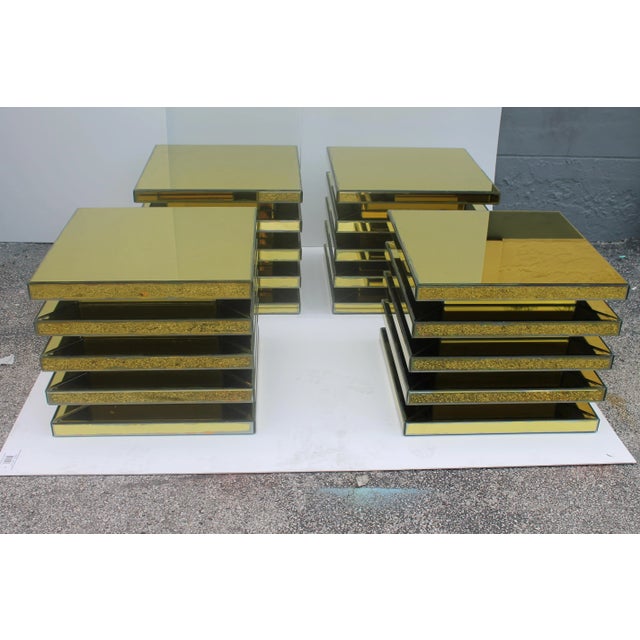 You will see these once in a life time. A set of 4 matching Mid Century Modern 5 tier completely clad in gold bevelled...