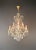 A classic chandelier in the Maria Theresa style, distinguished by its refined detailing and balanced elegance. This piece...