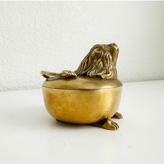 A wonderful brass box featuring lion's head, four feet, and tail. Nice weight and quality. A great accent to any tabletop...