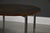 A pair of mid century modern round end tables designed by Florence Knoll with steel legs. Professionally refinished. Circa...