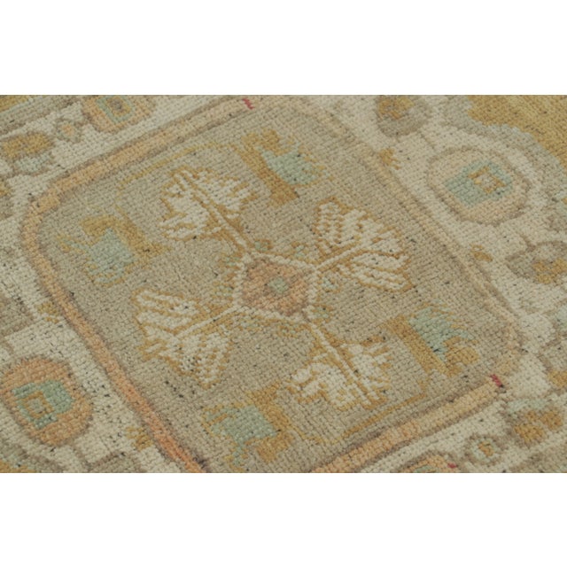 This vintage 2x3 Turkish gift rug, circa 1950–1959, features a refined medallion design rendered in soft ivory, sand, and...
