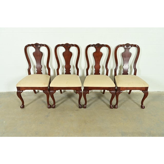 An outstanding set of four Chippendale or Georgian style dining chairs By Thomasville USA, Circa 1980s Carved solid cherry...