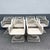 Larger chair: 26”w, 32”d, 32”h. A striking set of Mid Century Modern spun fiberglass swivel dining armchairs featuring an...