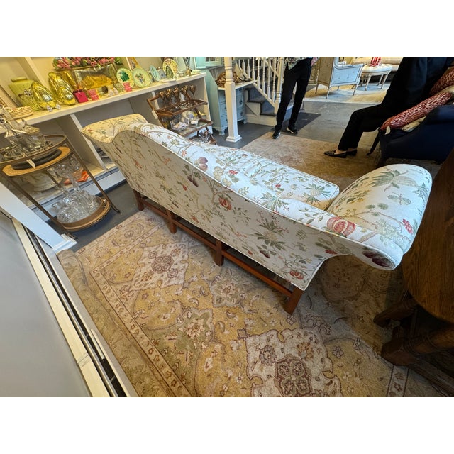 This is a Vintage Camelback sofa made by Kindel furniture. It has a mahogany wood base.in a Chippendale style. It has a...