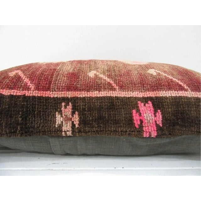 This is a pillow cover made from a vintage kilim rug. The piece was properly washed and ready to use. Pillow inserts not...