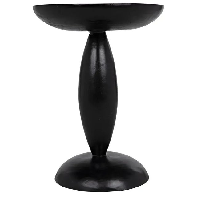 This sophisticated side table has been expertly hand-carved of solid mahogany with a hand-rubbed black finish. Its...