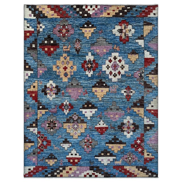A bold tribal Kazak rug with oversized stepped medallions and crosses in lavender, madder red, ivory, camel and chocolate...