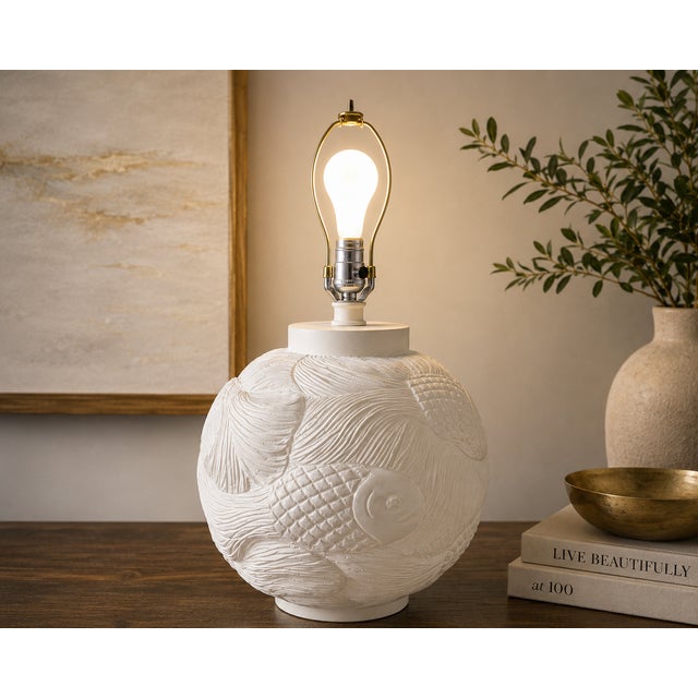 Bring sculptural elegance to your interior with this striking vintage bisque porcelain table lamp featuring an all-over...