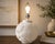 Bring sculptural elegance to your interior with this striking vintage bisque porcelain table lamp featuring an all-over...