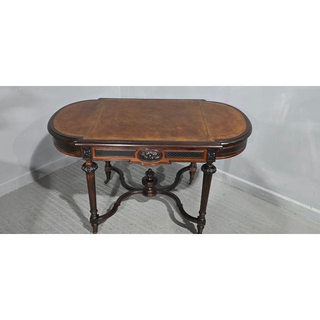 A superb quality C19th rosewood library writing table, or centre table, freestanding with full width drawer and tan...