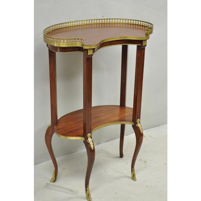 Vintage French Louis XV Style Mahogany 2 Tier Kidney Bean Shaped Side Table w/ Bronze Ormolu. Circa Mid 20th Century....
