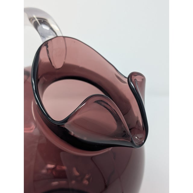 Vintage and handblown pieces from Blenko and Cambridge Glass are the stars of this curated eight piece group of amethyst...