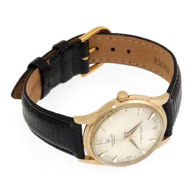 This is a vintage authentic men's wrist watch from Hamilton Thin-o-Matic Collection. The case is crafted from 14k yellow...