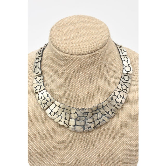 Vintage sterling silver hallmarked collar necklace with pebbled design. 50's Some black design in the silver. Has not been...
