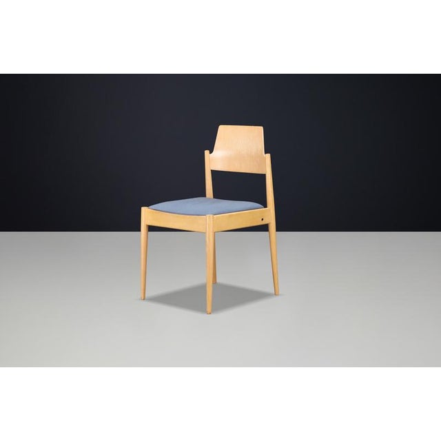 An original se 119 dining chair designed by the renowned german architect and designer egon eiermann and manufactured by...