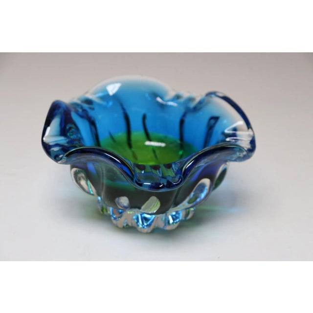 Italian art glass bowl/ashtray in vibrant blue and green with dense footed base, likely Murano (ca. 1970s). Given the...