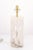 A sculptural twisted alabaster table lamp with brass hardware. The carved organic form offers a sophisticated modernist...