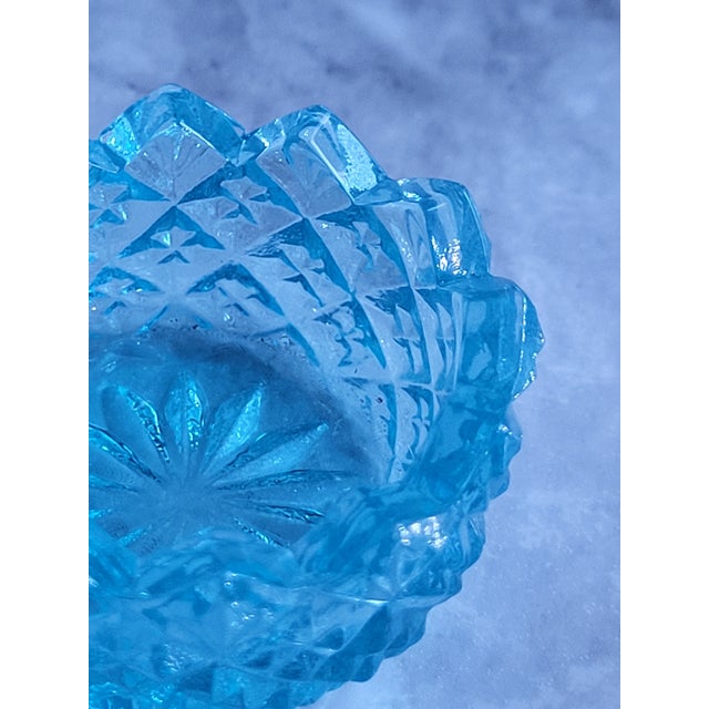 This is Kemple Tetec turquoise pressed glass in the star and fan pattern. It has a sawtooth edge and is typically used as...
