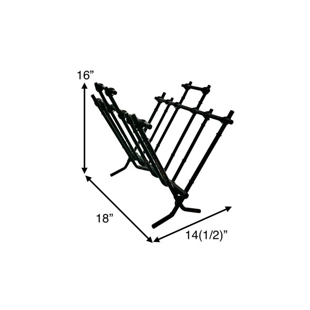 The Magazine Rack from the 1960s is a classy home decor piece made of black faux bamboo with a metallic finish. This...